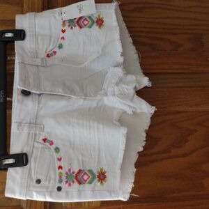 Rue21White Denim shorts has embroidered on front and back. Size7-8